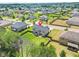 An aerial view shows the two-story home in a lake community with fenced backyard at 321 Shannon Ct, Mcdonough, GA 30252