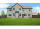 Spacious backyard featuring a lawn and the rear exterior of the home at 321 Shannon Ct, Mcdonough, GA 30252