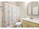 Bathroom showcasing a single sink vanity and a themed shower curtain at 321 Shannon Ct, Mcdonough, GA 30252