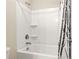 Bathroom featuring a white tub-shower combination with a black and white patterned shower curtain at 321 Shannon Ct, Mcdonough, GA 30252