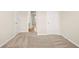 Bright bedroom featuring neutral carpet, light walls and a view to the bathroom at 321 Shannon Ct, Mcdonough, GA 30252