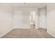 Bedroom with neutral carpeting and multiple doors, offering access to various parts of the home at 321 Shannon Ct, Mcdonough, GA 30252