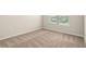 Bright bedroom with light walls, neutral carpet and a large window at 321 Shannon Ct, Mcdonough, GA 30252