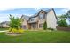 Charming two-story home with a well-manicured lawn and a two car garage at 321 Shannon Ct, Mcdonough, GA 30252