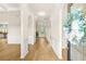 Bright foyer with hardwood floors, arched doorways, and detailed trim at 321 Shannon Ct, Mcdonough, GA 30252