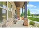 A welcoming front porch with stone and brick accents and manicured landscaping at 321 Shannon Ct, Mcdonough, GA 30252