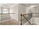 Upper hallway features a large window with views at 321 Shannon Ct, Mcdonough, GA 30252
