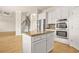Modern kitchen with granite countertops, island, stainless steel appliances and open floor plan at 321 Shannon Ct, Mcdonough, GA 30252
