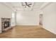 Bright living room features hardwood floors, coffered ceilings and a stone fireplace at 321 Shannon Ct, Mcdonough, GA 30252