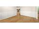 Living room shows wainscoting and an archway to the well-lit kitchen at 321 Shannon Ct, Mcdonough, GA 30252