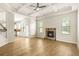 Spacious living room boasts hardwood floors, coffered ceilings and a stone fireplace at 321 Shannon Ct, Mcdonough, GA 30252