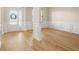 Open living room with hardwood floors, a front door view, and natural light at 321 Shannon Ct, Mcdonough, GA 30252