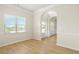 Bright living room with hardwood floors, large window, and elegant architectural details at 321 Shannon Ct, Mcdonough, GA 30252