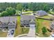 Aerial view of the property featuring lush landscaping and mature trees at 3302 Avenel Ct, Snellville, GA 30078