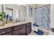 Well-lit bathroom featuring granite countertops and decorative mirror at 3302 Avenel Ct, Snellville, GA 30078