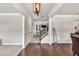 Open foyer with hardwood floors, detailed trim work, and view of the staircase at 3302 Avenel Ct, Snellville, GA 30078