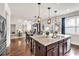 Modern kitchen island with granite countertops, stainless appliances and an open floor plan at 3302 Avenel Ct, Snellville, GA 30078