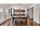 Open kitchen and dining area with dark wood cabinets and stainless steel appliances at 3302 Avenel Ct, Snellville, GA 30078