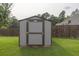 A wooden shed situated on a well-maintained lawn at 3302 Avenel Ct, Snellville, GA 30078