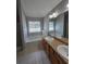 Bright bathroom with a soaking tub, double sinks, and granite counters providing style and functionality at 4677 Liberty Square Dr, Acworth, GA 30101