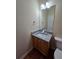 Bathroom vanity with granite countertop, mirror, and modern fixtures at 4677 Liberty Square Dr, Acworth, GA 30101