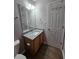 A modern half-bathroom featuring granite counters, new fixtures, and modern finishes at 4677 Liberty Square Dr, Acworth, GA 30101