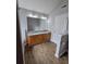 Bathroom features a double sink vanity with wood cabinets, granite countertop, and wood flooring at 4677 Liberty Square Dr, Acworth, GA 30101