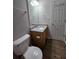 Bathroom features a wood vanity with granite countertop, a single sink, and neutral walls at 4677 Liberty Square Dr, Acworth, GA 30101