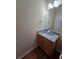 Bathroom vanity with granite countertop, mirror, and modern fixtures at 4677 Liberty Square Dr, Acworth, GA 30101