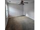 Bedroom features neutral walls, carpet, and a lighted ceiling fan at 4677 Liberty Square Dr, Acworth, GA 30101