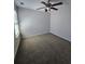 Bedroom features neutral walls, carpet, and a lighted ceiling fan at 4677 Liberty Square Dr, Acworth, GA 30101