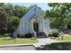 Charming clubhouse with inviting entryway, porch, and well-manicured lawn at 4677 Liberty Square Dr, Acworth, GA 30101