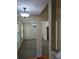 View of the dining and living rooms, with neutral carpet and light fixtures at 4677 Liberty Square Dr, Acworth, GA 30101