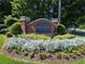 The Liberty Square brick entrance sign is surrounded by colorful landscaping at 4677 Liberty Square Dr, Acworth, GA 30101