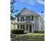 Charming two-story home with a covered front porch and well-maintained landscaping at 4677 Liberty Square Dr, Acworth, GA 30101