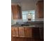 Kitchen with granite countertops, stainless steel appliances, and wood cabinets at 4677 Liberty Square Dr, Acworth, GA 30101