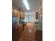 Well-lit kitchen featuring stainless steel appliances, granite countertops, and hardwood floors at 4677 Liberty Square Dr, Acworth, GA 30101
