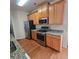 This kitchen features stainless steel appliances, granite countertops, and wooden cabinets at 4677 Liberty Square Dr, Acworth, GA 30101