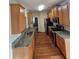 Kitchen showcasing granite counters, stainless appliances, and attractive wood flooring at 4677 Liberty Square Dr, Acworth, GA 30101