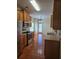 Bright kitchen with wood cabinets, stainless appliances, wood floors, and view of the breakfast nook at 4677 Liberty Square Dr, Acworth, GA 30101