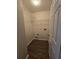 Well-lit laundry room featuring wood-look flooring and wire shelving at 4677 Liberty Square Dr, Acworth, GA 30101