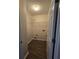 Well-lit laundry room featuring wood-look flooring and wire shelving at 4677 Liberty Square Dr, Acworth, GA 30101