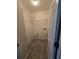 Well-organized laundry room with wire shelving and modern tile flooring at 4677 Liberty Square Dr, Acworth, GA 30101