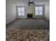 Spacious living room featuring a cozy brick fireplace and lots of natural light at 4677 Liberty Square Dr, Acworth, GA 30101