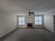 Spacious living room featuring neutral walls, carpet, and fireplace at 4677 Liberty Square Dr, Acworth, GA 30101