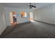 Open concept living space with hardwood floors and view into kitchen at 4677 Liberty Square Dr, Acworth, GA 30101