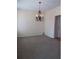 Spacious living room with a decorative chandelier and neutral carpet at 4677 Liberty Square Dr, Acworth, GA 30101