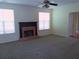 Cozy living room with a fireplace and large windows for natural light at 4677 Liberty Square Dr, Acworth, GA 30101