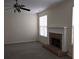 Spacious living room with fireplace, carpeted floors, and a ceiling fan at 4677 Liberty Square Dr, Acworth, GA 30101