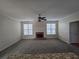 Spacious living room featuring a cozy brick fireplace and lots of natural light at 4677 Liberty Square Dr, Acworth, GA 30101